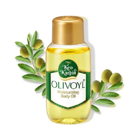 Clear bottle of Keo Karpin Olivoyl body oil with olive branches and green olives.