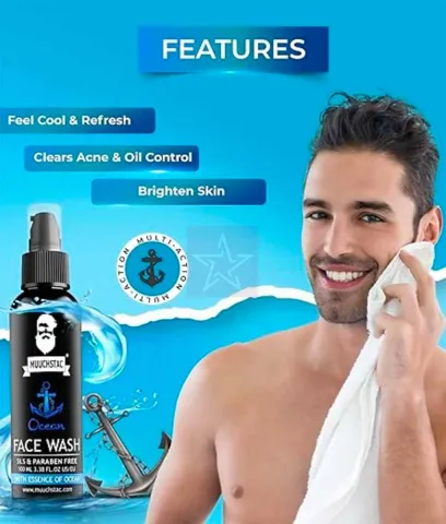 Smiling man drying face with towel next to face wash product and blue ocean-themed background.