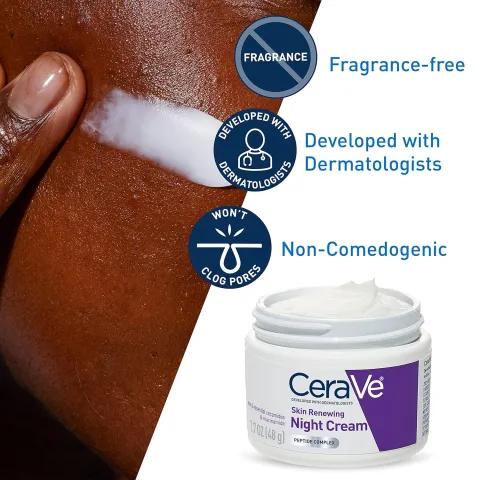 Hand applying CeraVe night cream to dark skin, cream jar shown at lower right.