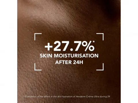 Close-up of moisturized brown skin with emphasized hydrated texture.