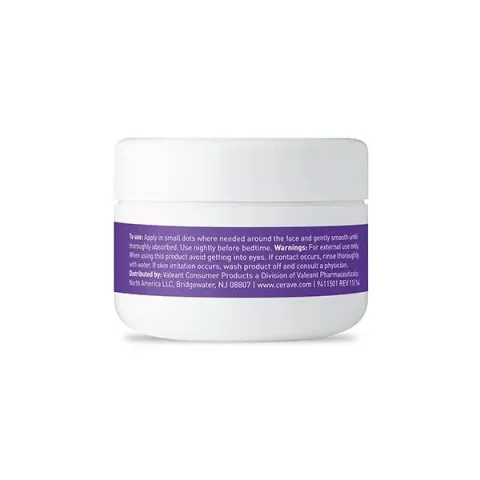 White cosmetic jar with a purple label and white text on a plain background.