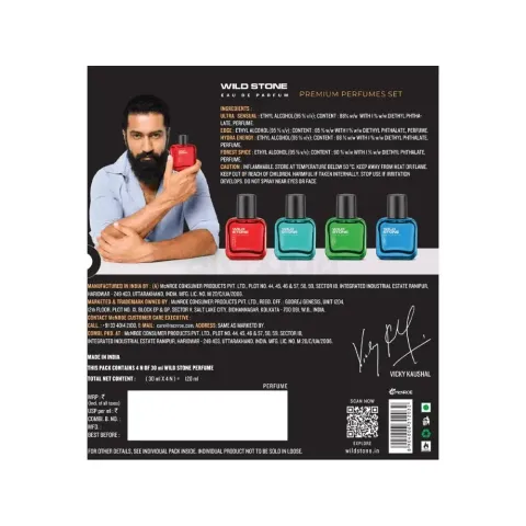 Man with a beard holding a red cologne bottle, four colorful bottles displayed in a row.