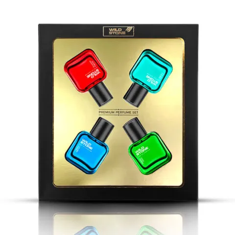 Four colorful perfume bottles in a square black and gold gift box.