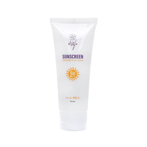 White tube of sunscreen with a yellow sun icon and purple text on the front.