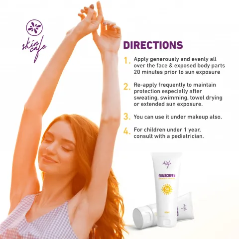 Smiling woman in sunlight next to skincare product packaging and product use directions.