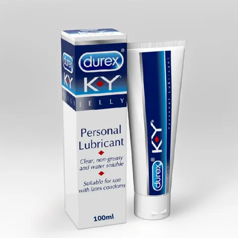Durex K-Y Jelly personal lubricant tube standing next to its box on a gray background.