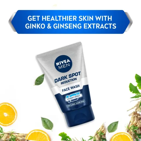 Nivea Men Dark Spot Reduction face wash tube with citrus slices and leaves around.