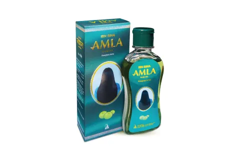 Amla hair oil bottle and packaging in green and yellow colors.