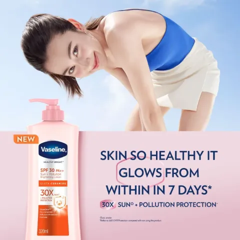 Woman in a blue top smiling outdoors next to a Vaseline lotion bottle and product claim.