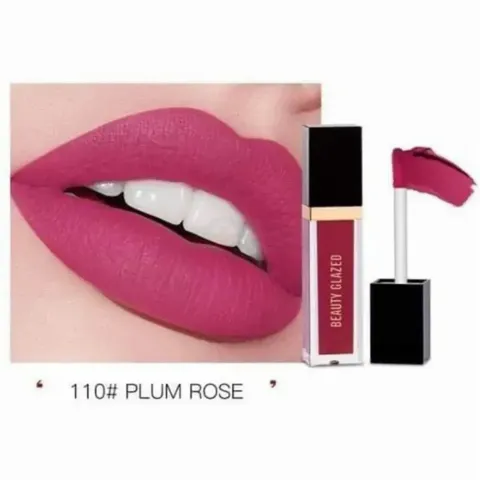 Close-up of lips wearing plum rose lipstick, with matching liquid lipstick tube and applicator.
