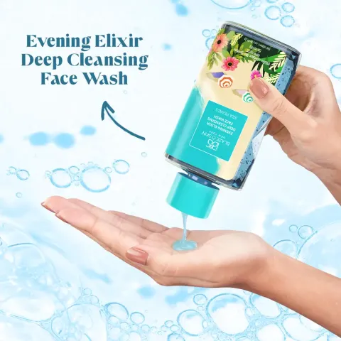 Hand pouring liquid face wash from a floral bottle onto palm, blue bubbles in background.