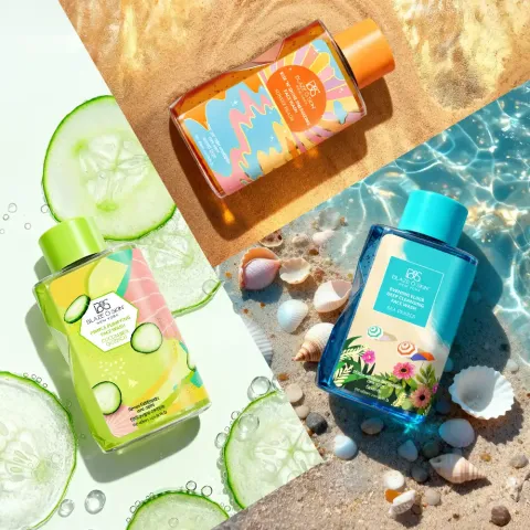 Three colorful skincare bottles displayed with cucumbers, seashells, and water backgrounds.