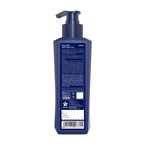 Back of a dark blue plastic pump bottle with white label and text.