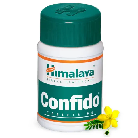 Himalaya Confido tablets bottle with a yellow flower beside it.