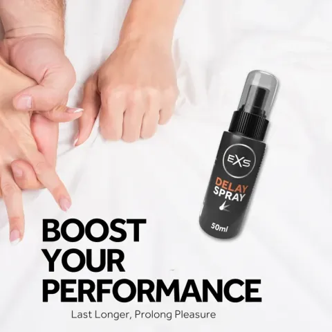 Black delay spray bottle on white bed near intertwined hands.