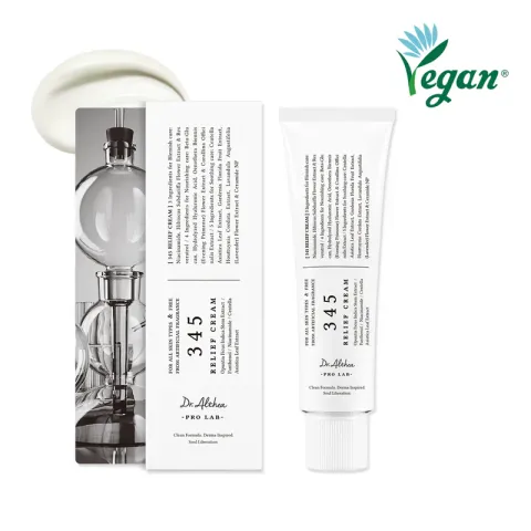 White tube of skincare cream with box, vegan logo in green, cream smear above.