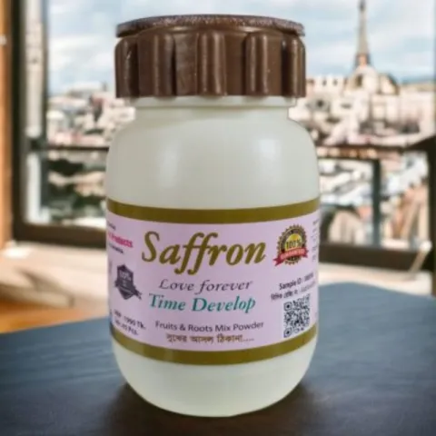 Plastic jar labeled "Saffron" on a table with a cityscape visible in the background.