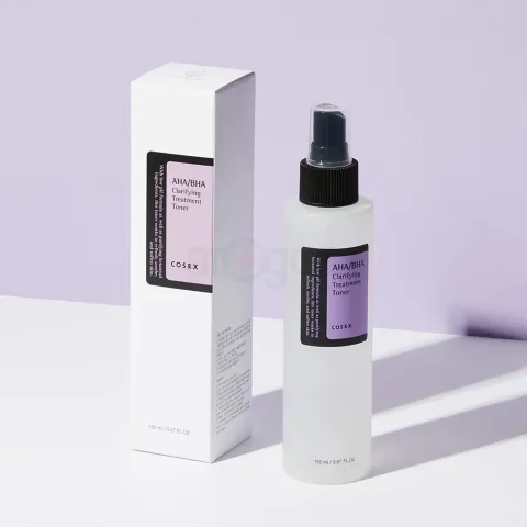 Clear spray bottle with black pump and matching white box on a light purple background.