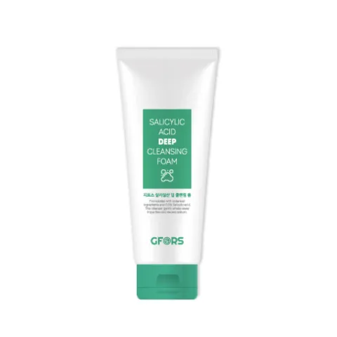 White tube of cleansing foam with green label and cap on a plain background.