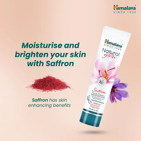 Himalaya face wash tube with saffron strands and a saffron flower on a peach background.