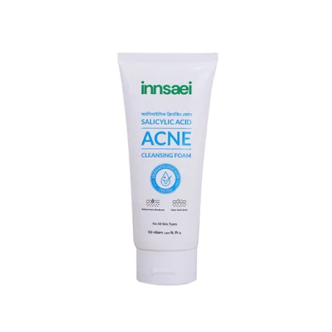 White tube of Innisai Acne Cleansing Foam with blue and green text.