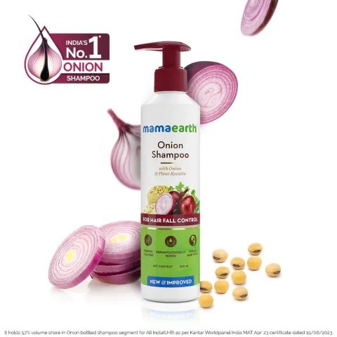 Mamaearth Onion Shampoo bottle with sliced red onions and yellow tablets around it.
