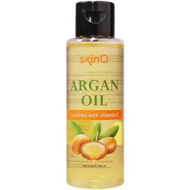 Clear plastic bottle of SkinO argan oil with black flip top and argan nuts on the label.