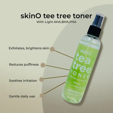 Clear bottle of skinO tea tree toner with a black spray cap on a light background.