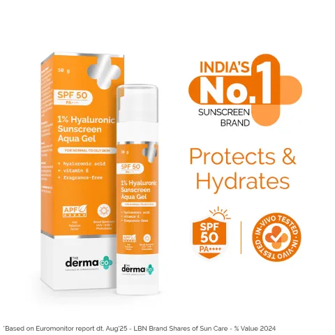 Derma Co. sunscreen packaging and bottle in orange and white with SPF 50 highlights.
