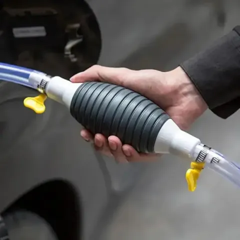 Fuel transfer pump with flexible hoses  valves.