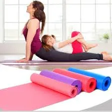 Woman and child doing yoga on mats in a bright room with colorful mats in the foreground.