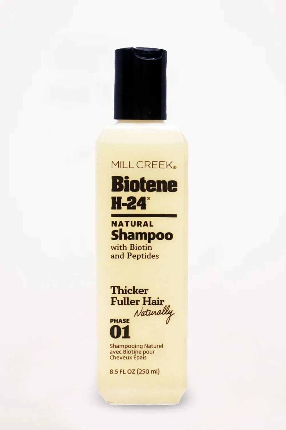Biotene H-24 natural shampoo bottle with black cap on white background.