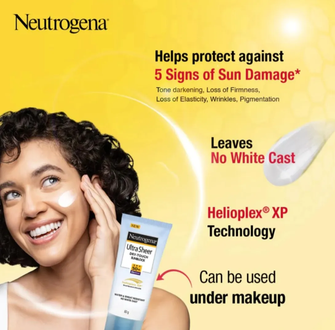 Smiling woman with curly hair holding Neutrogena sunscreen tube on a yellow background.