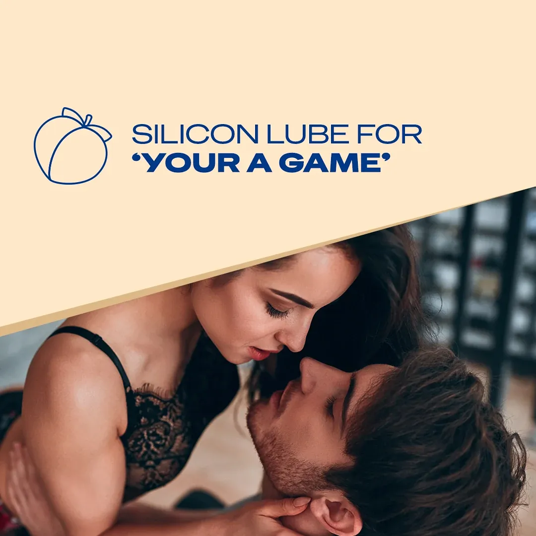 Woman in lingerie leaning over a man in an intimate, romantic setting.