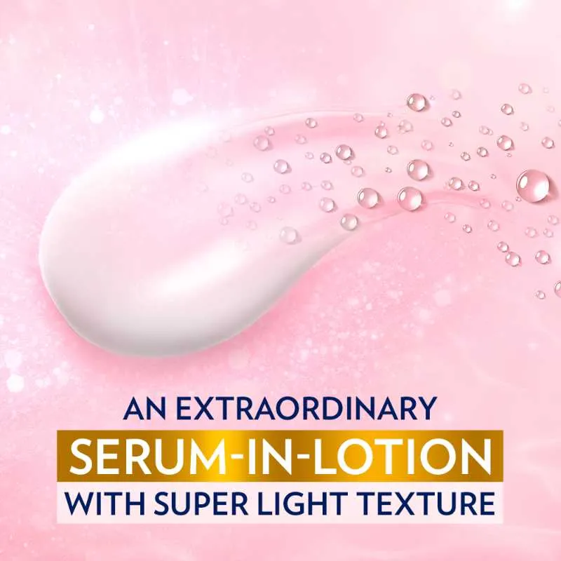 White serum lotion smear with droplets on a soft pink background.