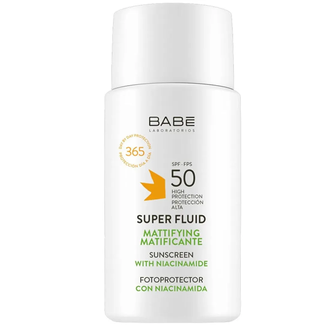 White bottle of Babe Super Fluid sunscreen SPF 50 with green and orange text accents.
