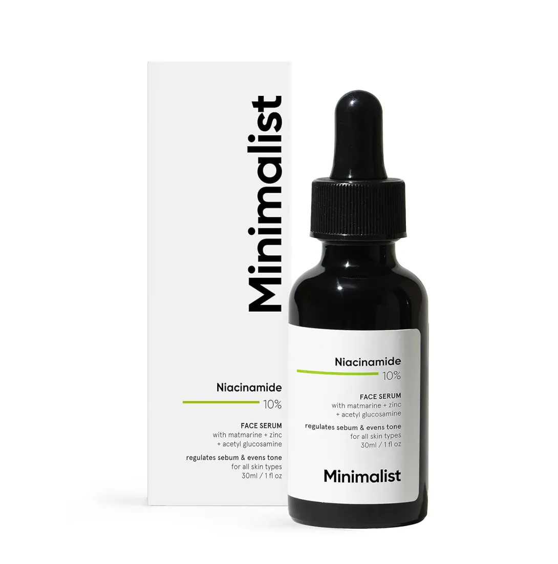Minimalist niacinamide serum bottle with dropper and white product box