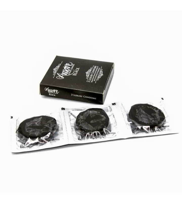 Black condom box with three individually wrapped black condoms in front.