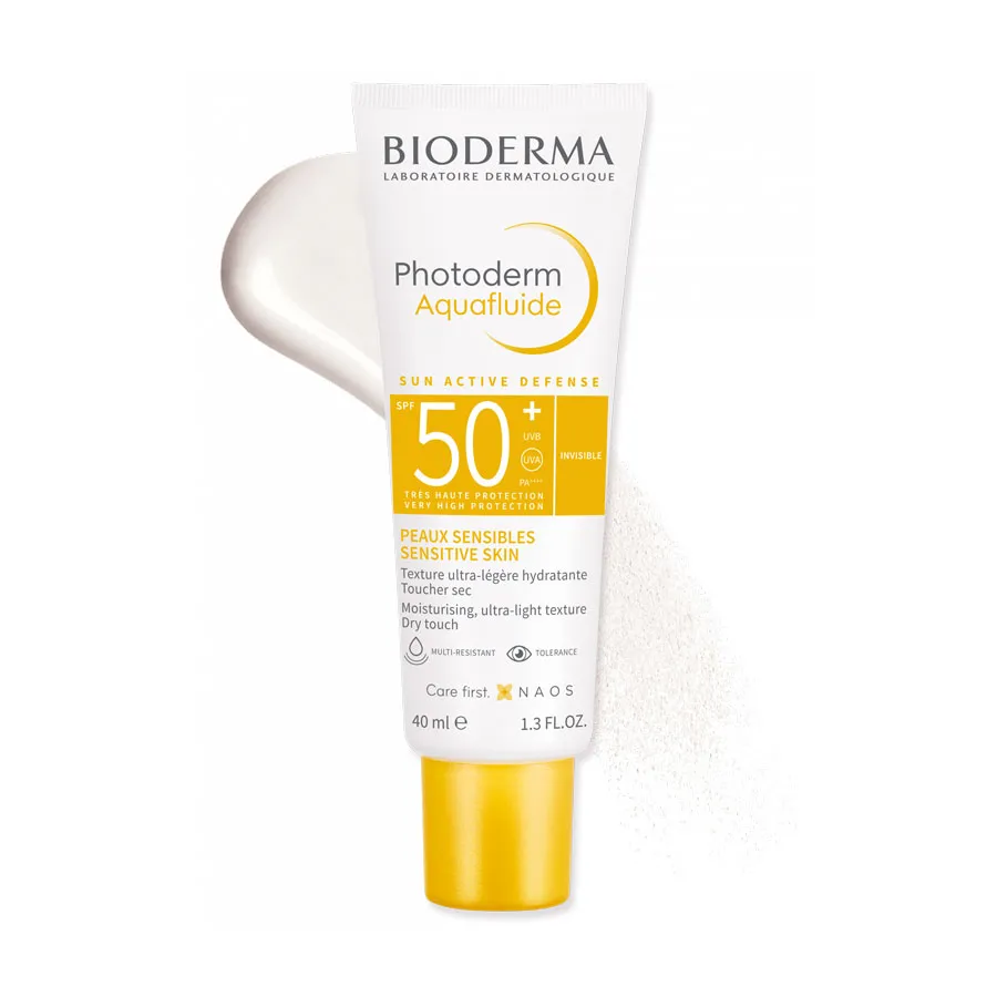 Bioderma Photoderm Aquafluide SPF 50+ sunscreen tube with yellow cap and swatch.