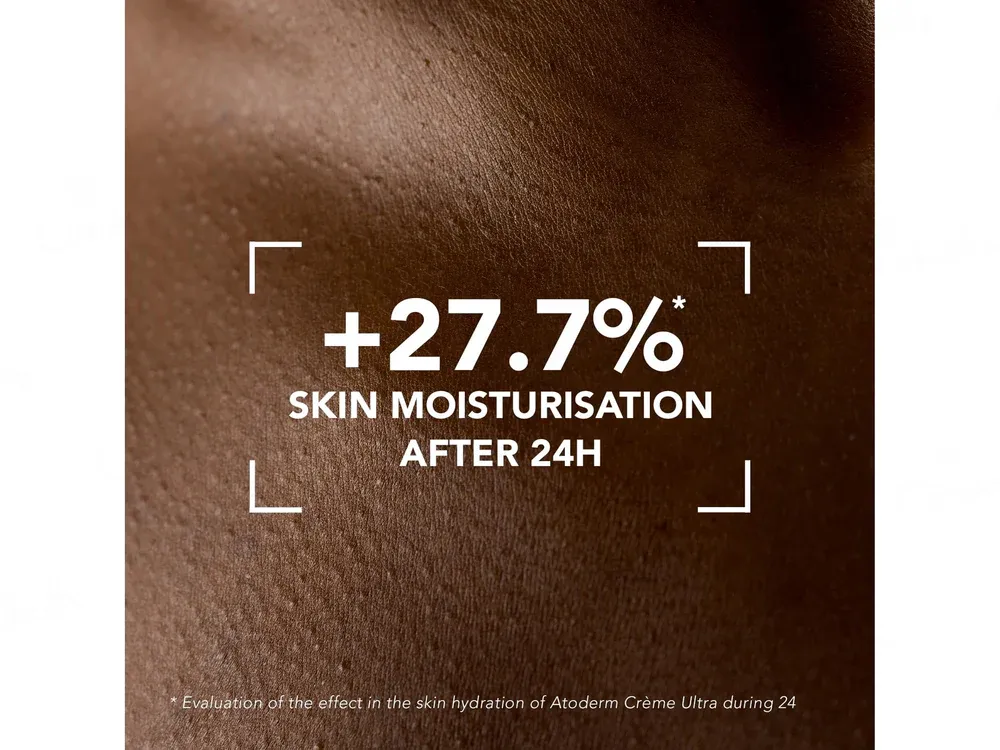 Close-up of moisturized brown skin with emphasized hydrated texture.