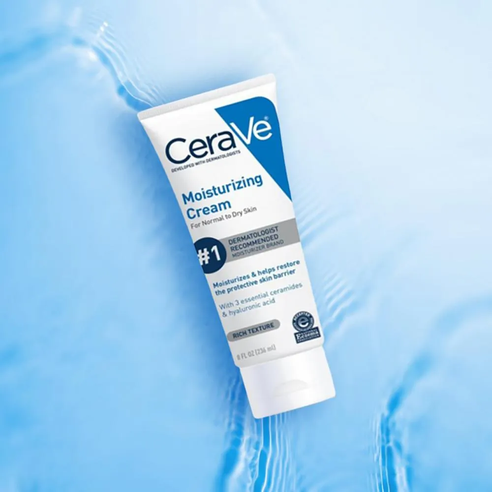 CeraVe Moisturizing Cream tube on a light blue background with water ripples.