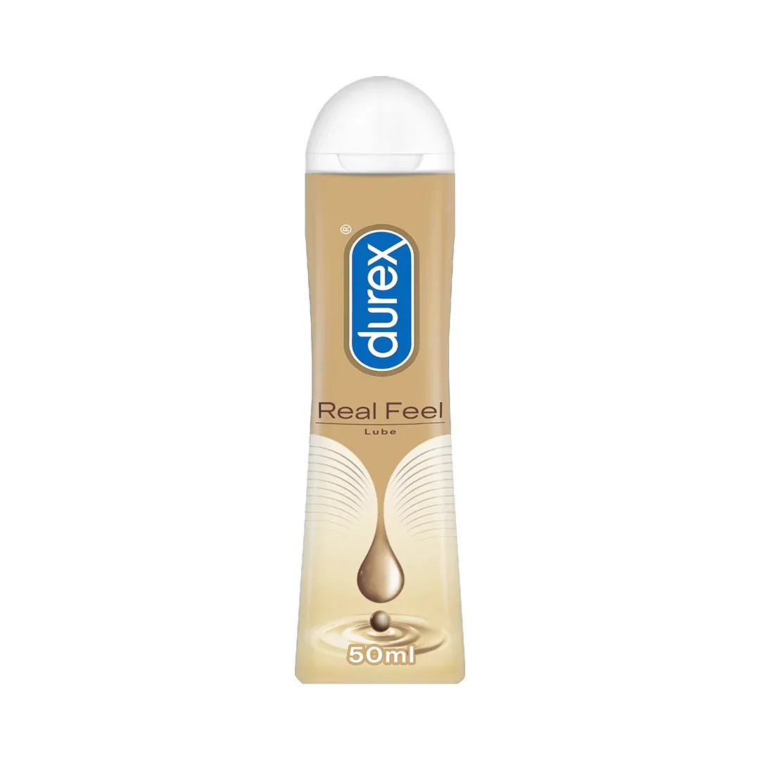 Durex Real Feel lubricant bottle with a gold label and white cap.