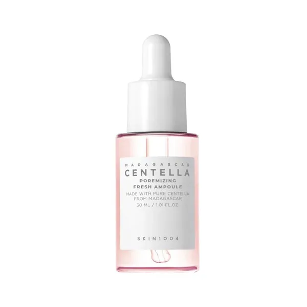 Clear serum bottle with a white dropper cap and pink-tinted liquid inside.