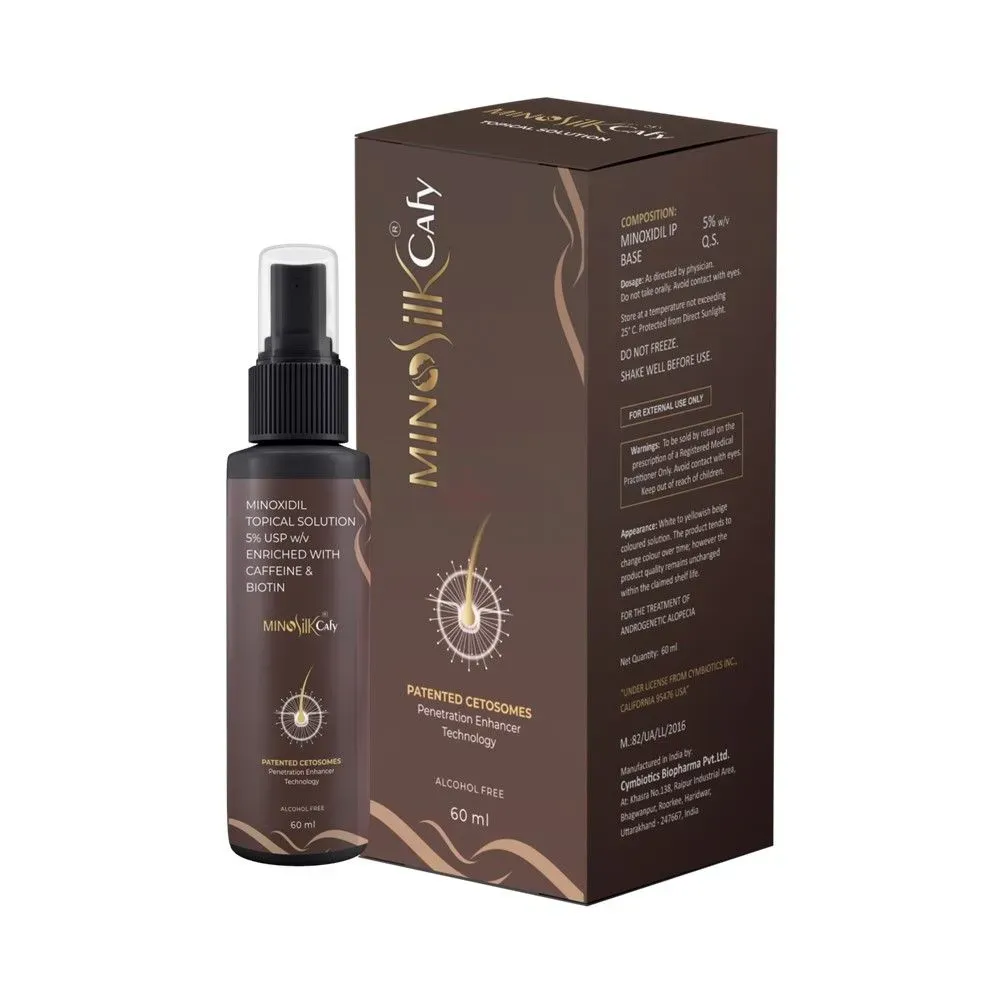 Dark brown spray bottle with matching product packaging featuring gold accents.