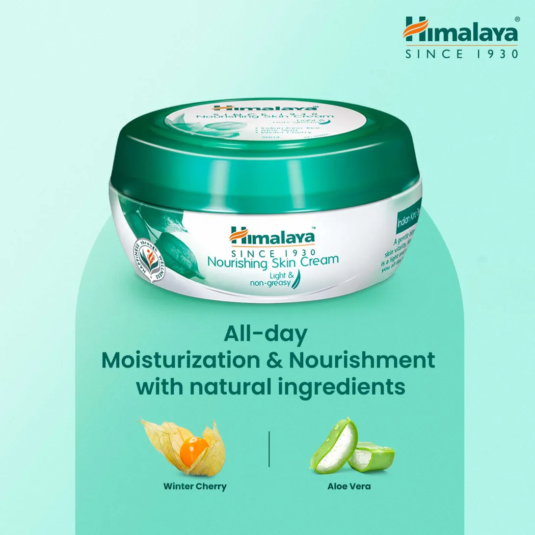 Himalaya Nourishing Skin Cream jar with green lid on a light blue background.