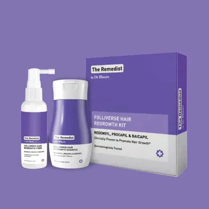 Purple and white hair care kit packaging with two bottles and a box on a purple background.