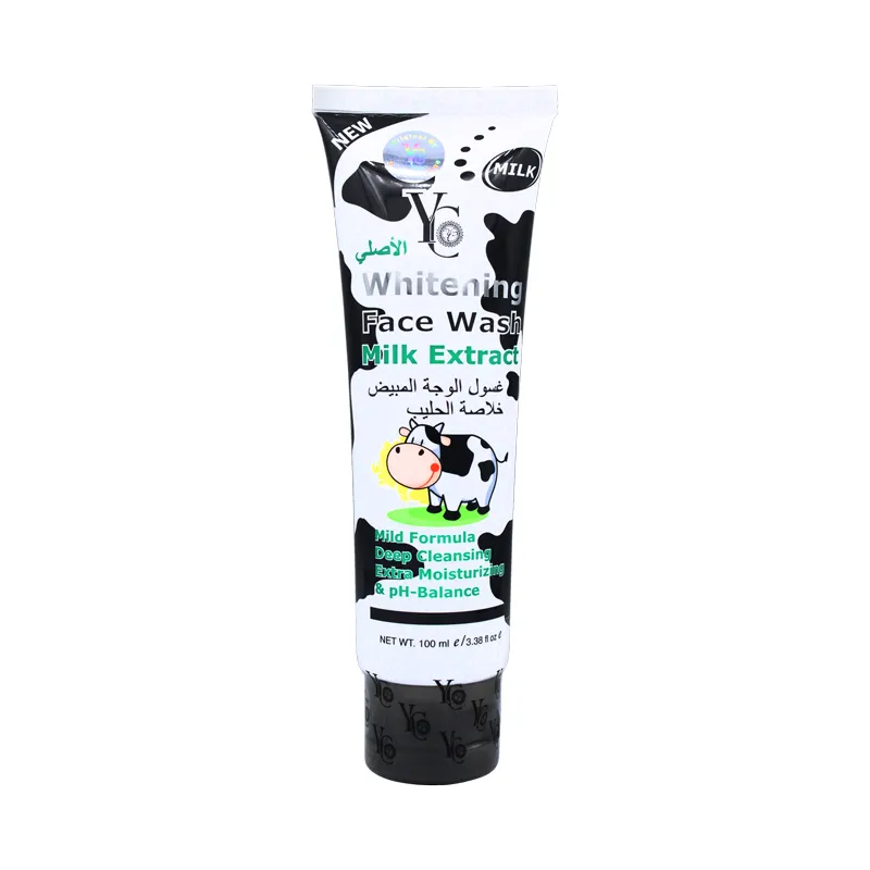 Tube of whitening face wash with milk extract, decorated with a cartoon cow and black accents.