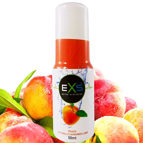 Peach flavored lubricant bottle with peaches in the background.