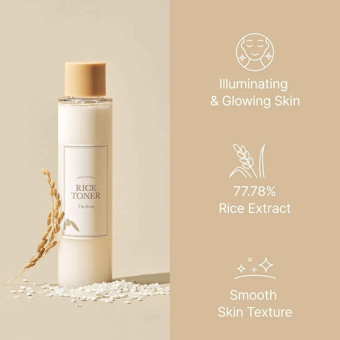 Skincare bottle with rice grains on a beige background, highlighting rice extract benefits.